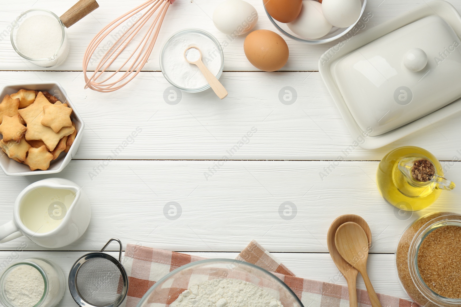 Photo of Frame of many different products on white wooden table, flat lay. Space for text