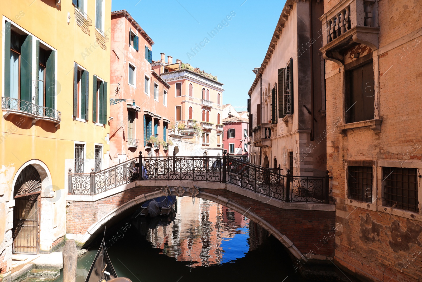 Photo of VENICE, ITALY - JUNE 13, 2019: City canal with old buildings and boats