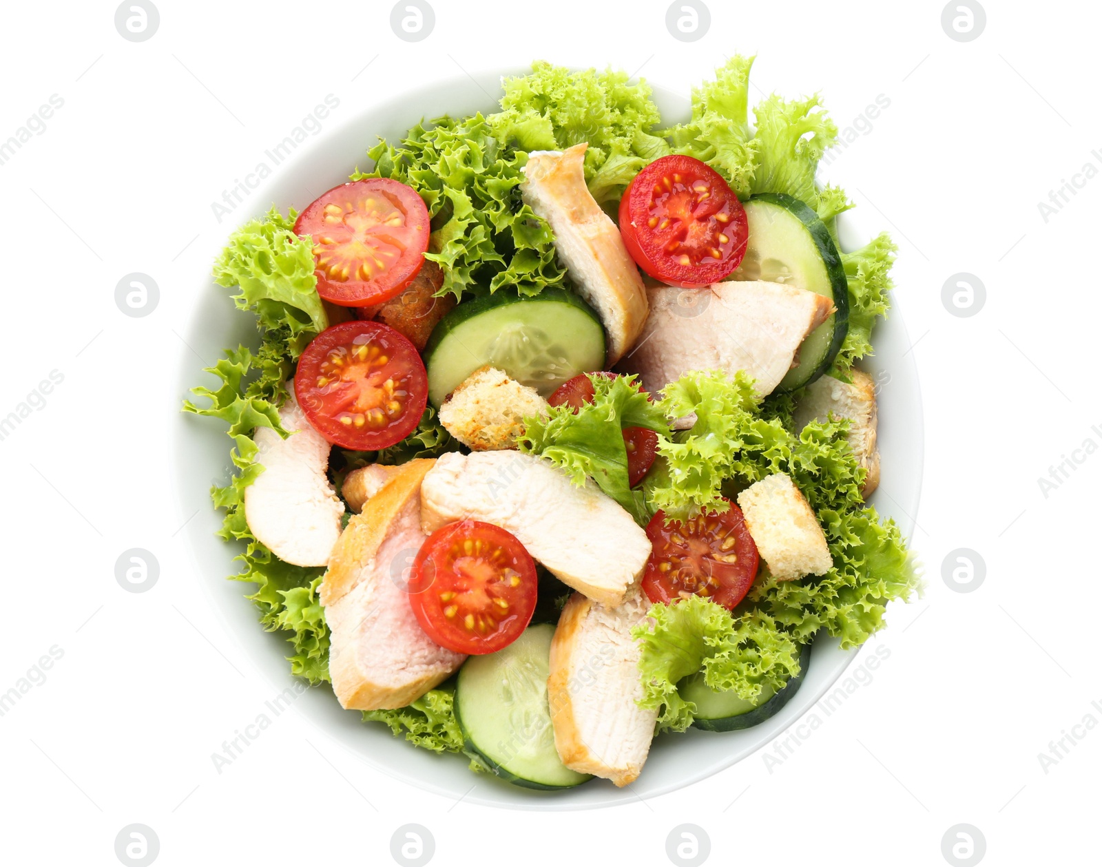 Photo of Delicious salad with chicken and vegetables in bowl isolated on white, top view