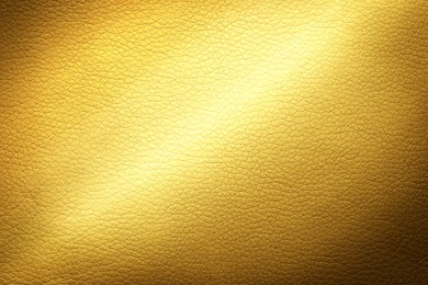 Image of Golden textured surface as background, closeup view