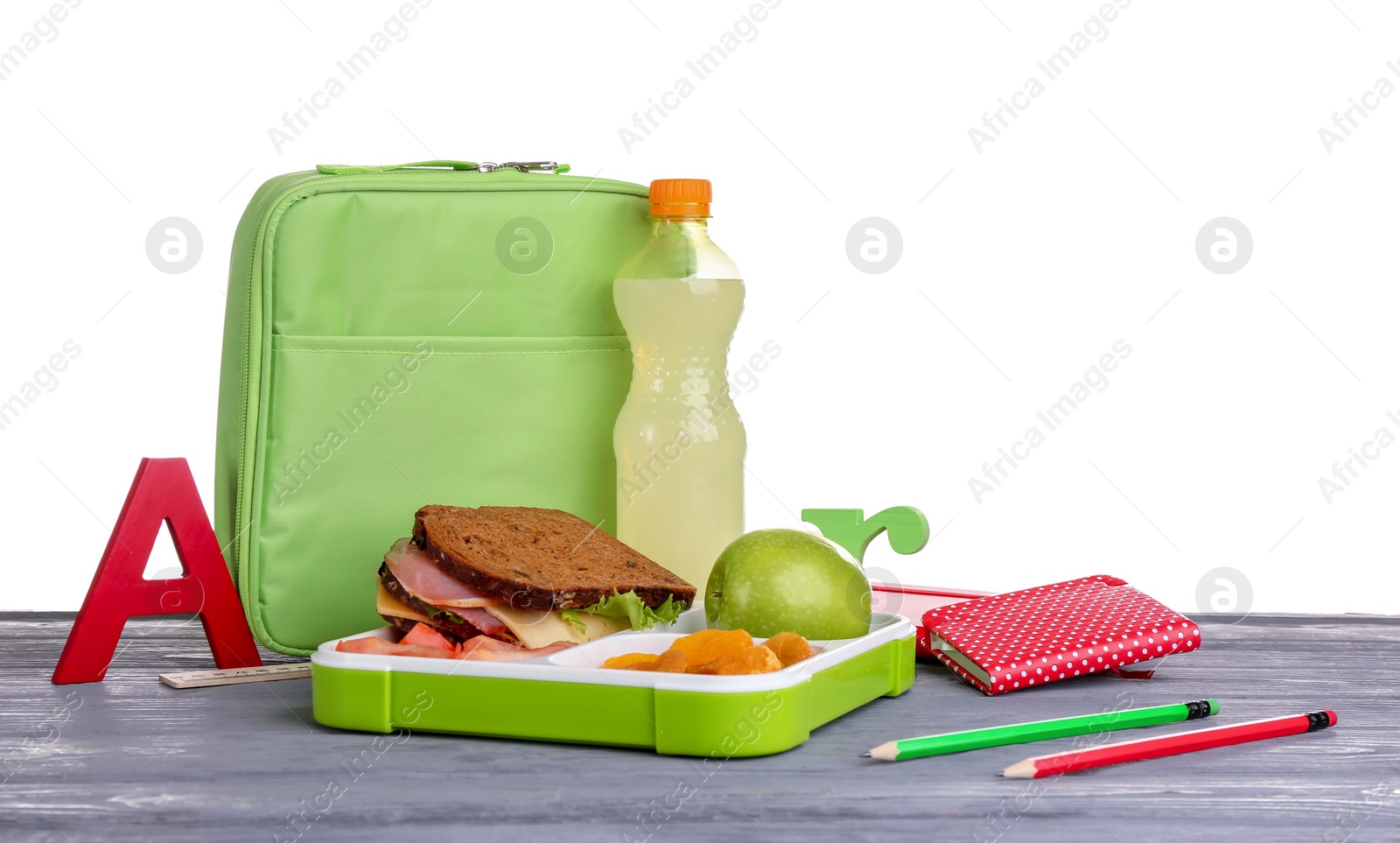 Photo of Composition with lunch box and food on table against white background