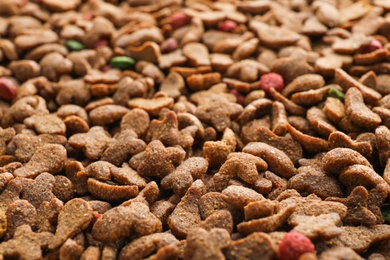 Dry pet food as background, closeup view