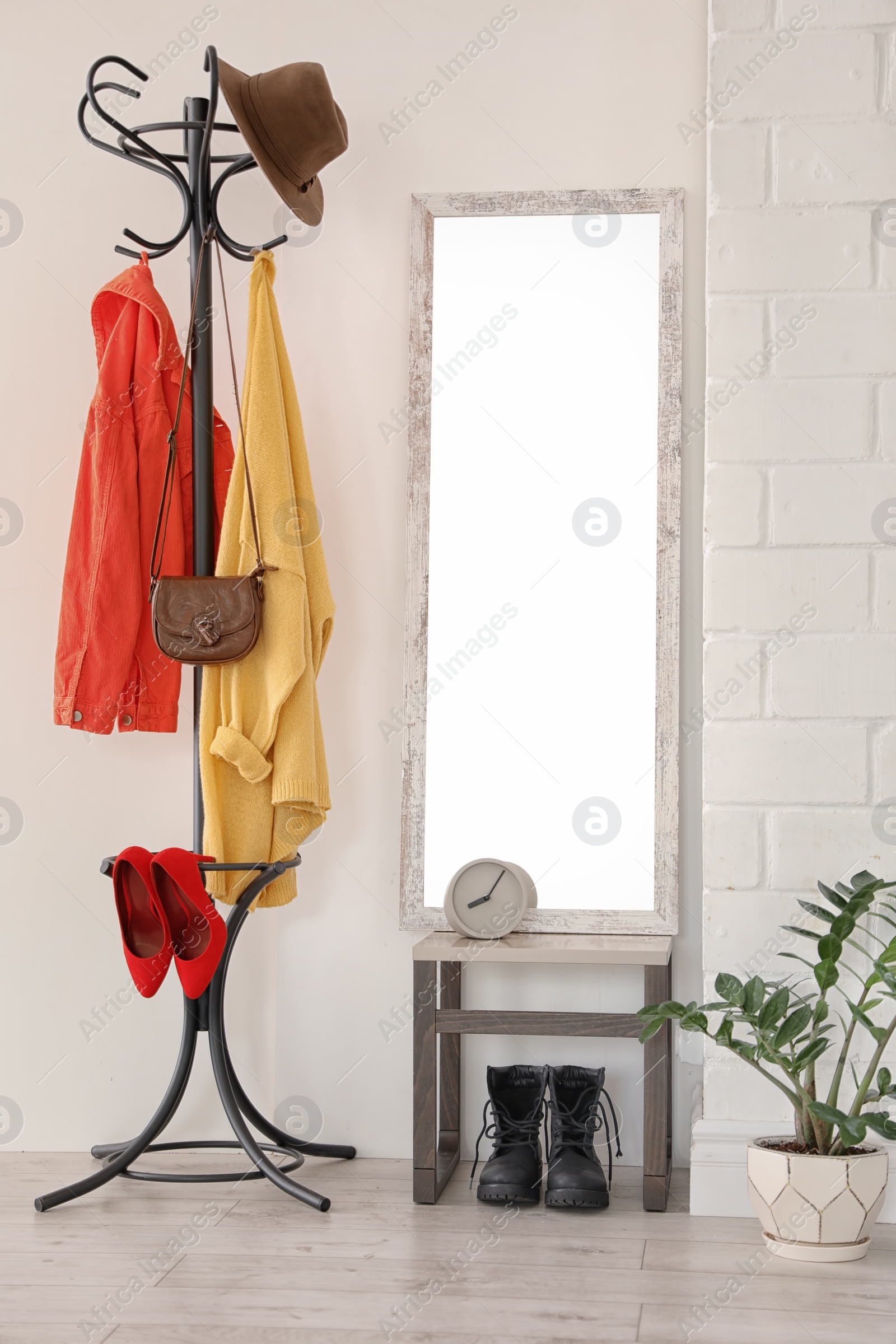 Photo of Stylish hallway interior with large mirror