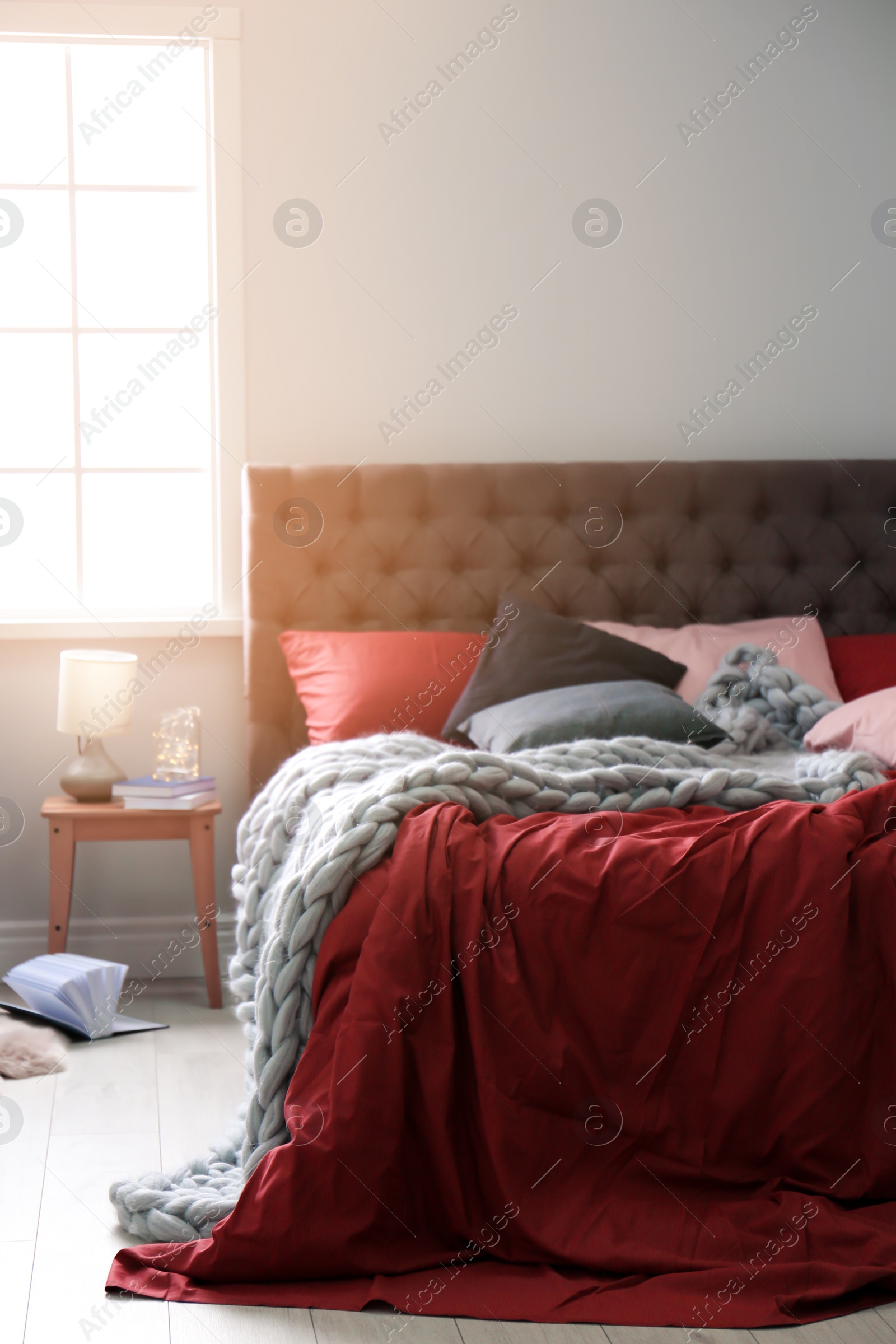 Photo of Comfortable bed in light modern room