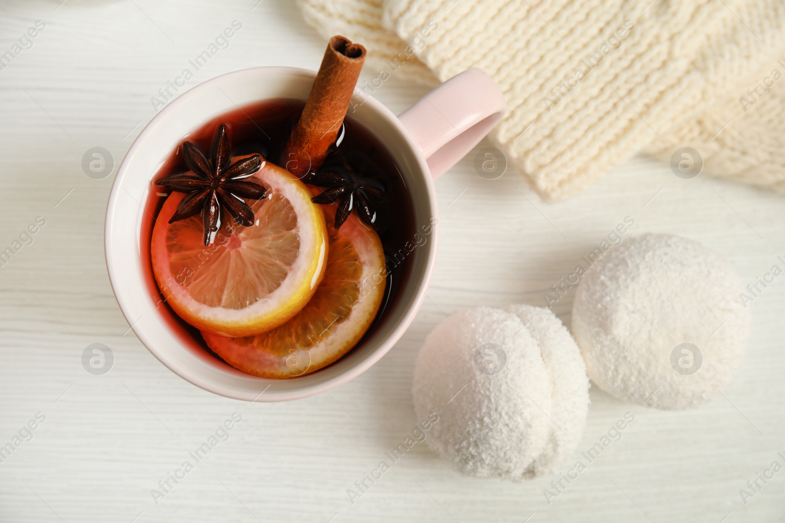 Photo of Flat lay composition with cup of hot winter drink on wooden background. Cozy season