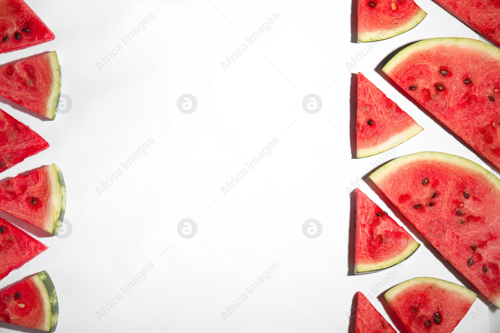 Photo of Slices of ripe watermelon on white background, flat lay. Space for text