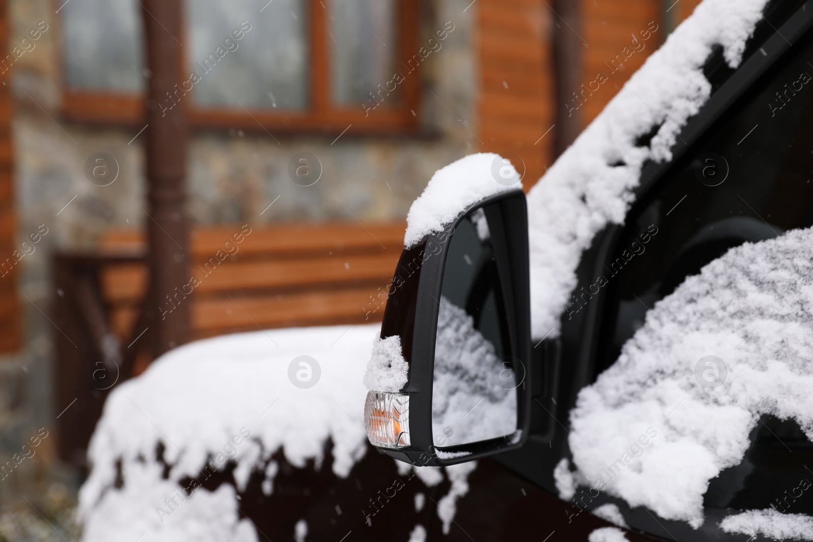 Photo of Car covered with snow after storm outdoors on beautiful winter day, closeup. Space for text