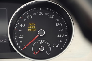 Image of Closeup view of dashboard with warning icon check airbag system in car