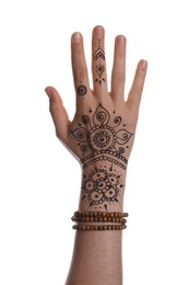 Woman with beautiful henna tattoo on hand against white background, closeup. Traditional mehndi