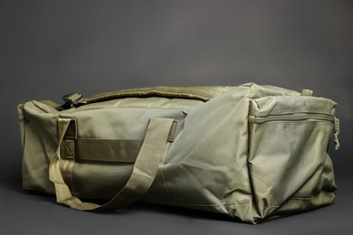 Army bag on dark grey background. Military equipment