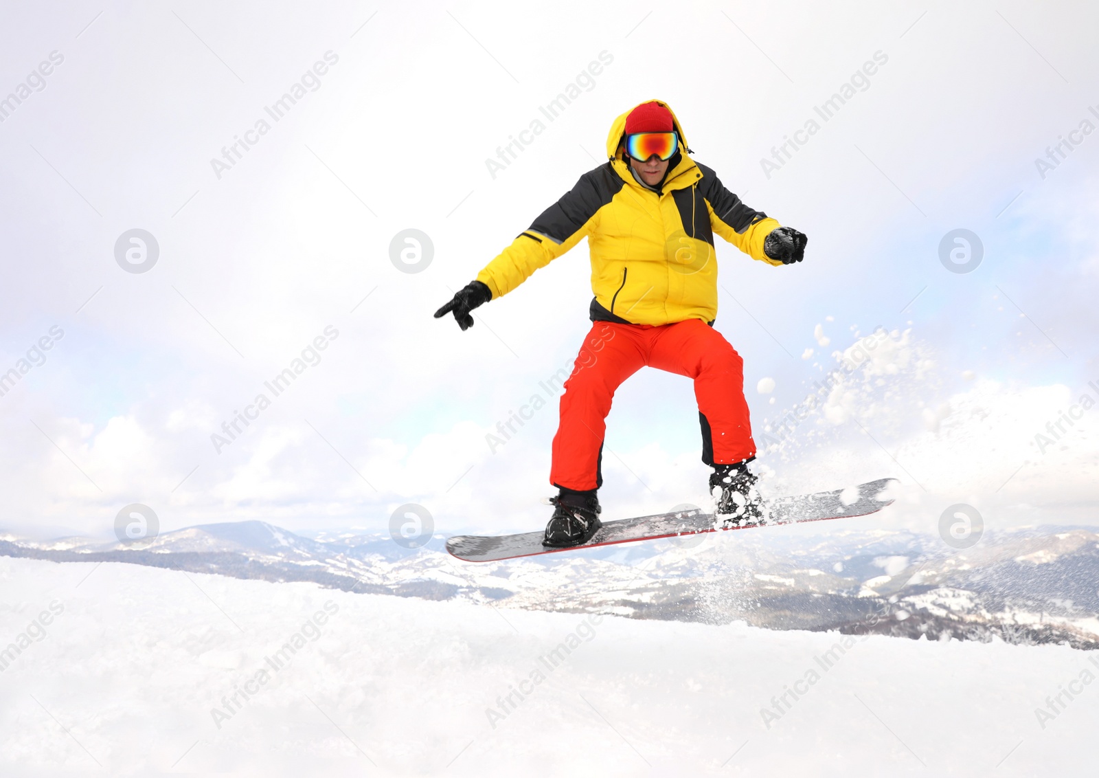 Photo of Male snowboarder on snowy hill. Winter vacation