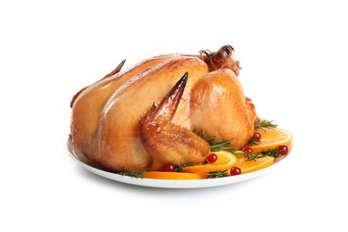 Photo of Platter of cooked turkey with garnish on white background