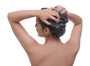 Photo of Woman washing hair on white background, back view