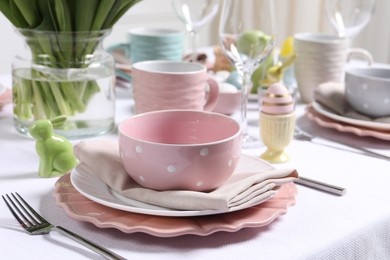 Photo of Festive table setting with elegant dishware, closeup. Easter celebration