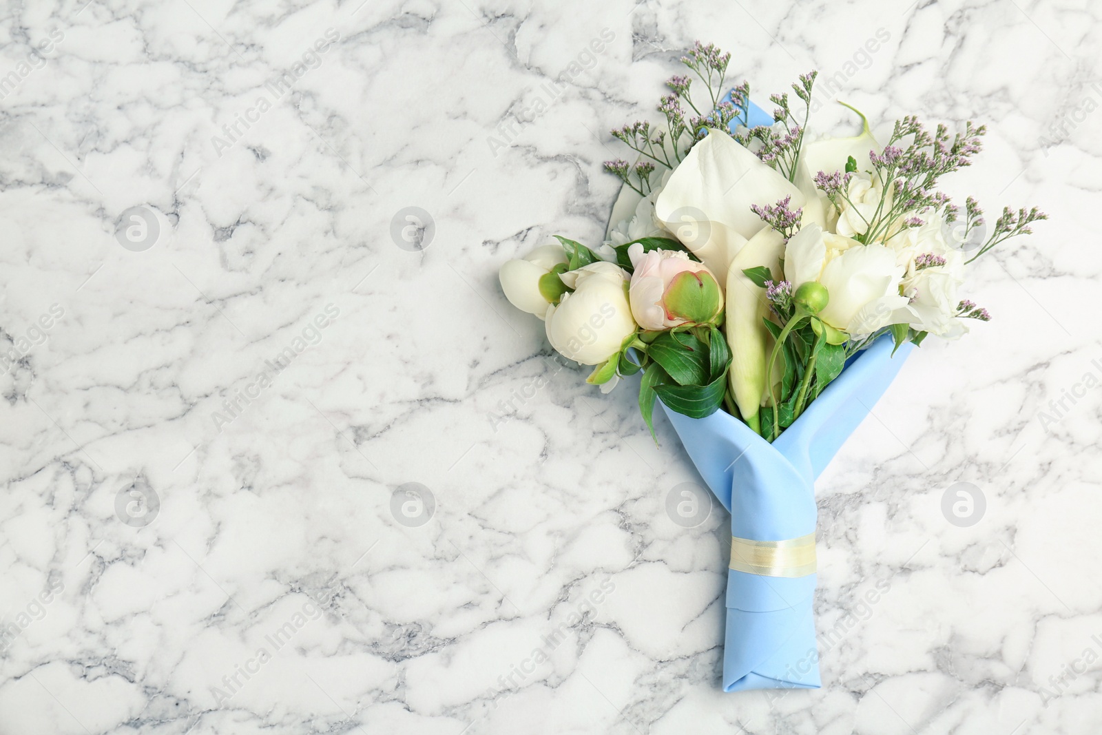 Photo of Bouquet of beautiful fragrant flowers on marble background