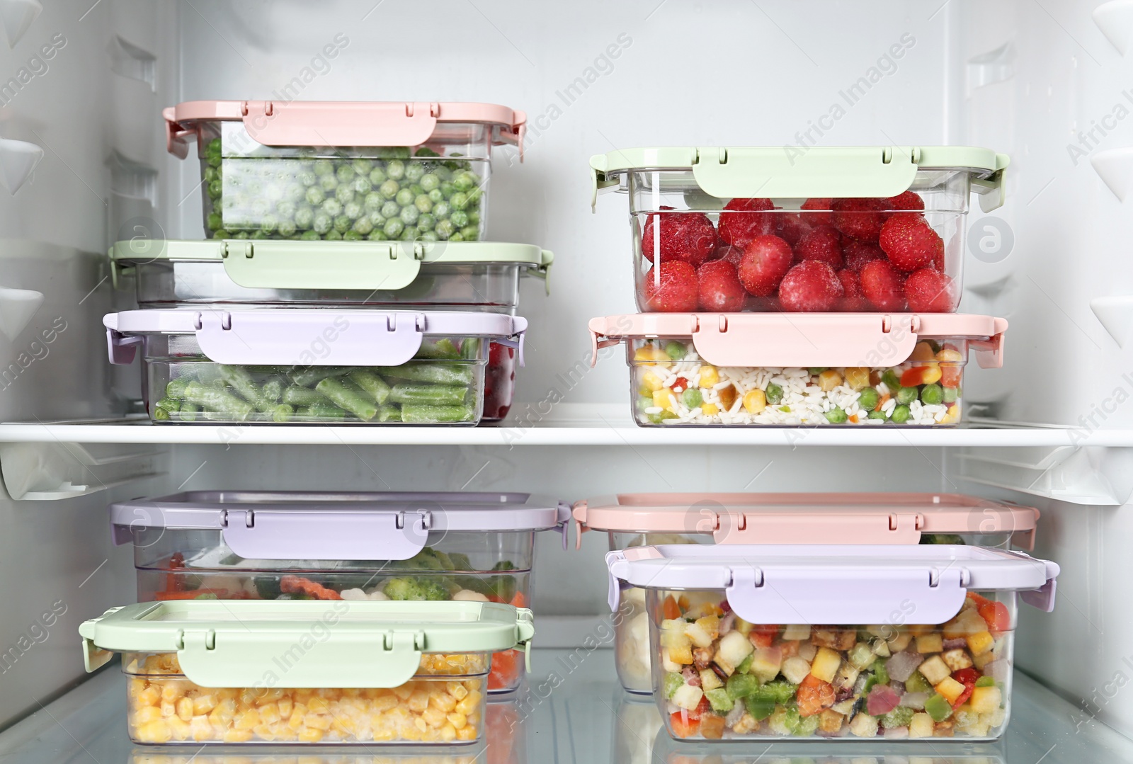 Photo of Boxes with different products inside of refrigerator