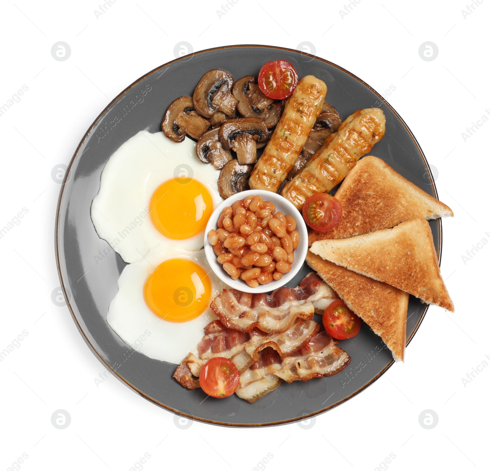 Photo of Plate of cooked traditional English breakfast isolated on white, top view