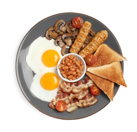 Photo of Plate of cooked traditional English breakfast isolated on white, top view