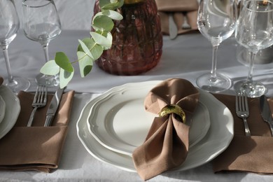 Beautiful place setting for festive dinner on table