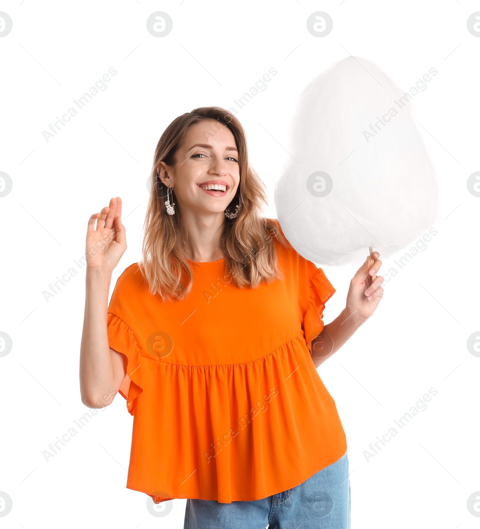 Photo of Happy young woman with cotton candy on white background