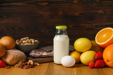 Photo of Allergenic food. Different fresh products on wooden table