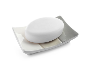 Holder with soap bar on white background