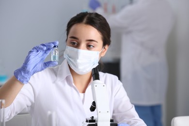Photo of Scientist working with sample in chemical laboratory