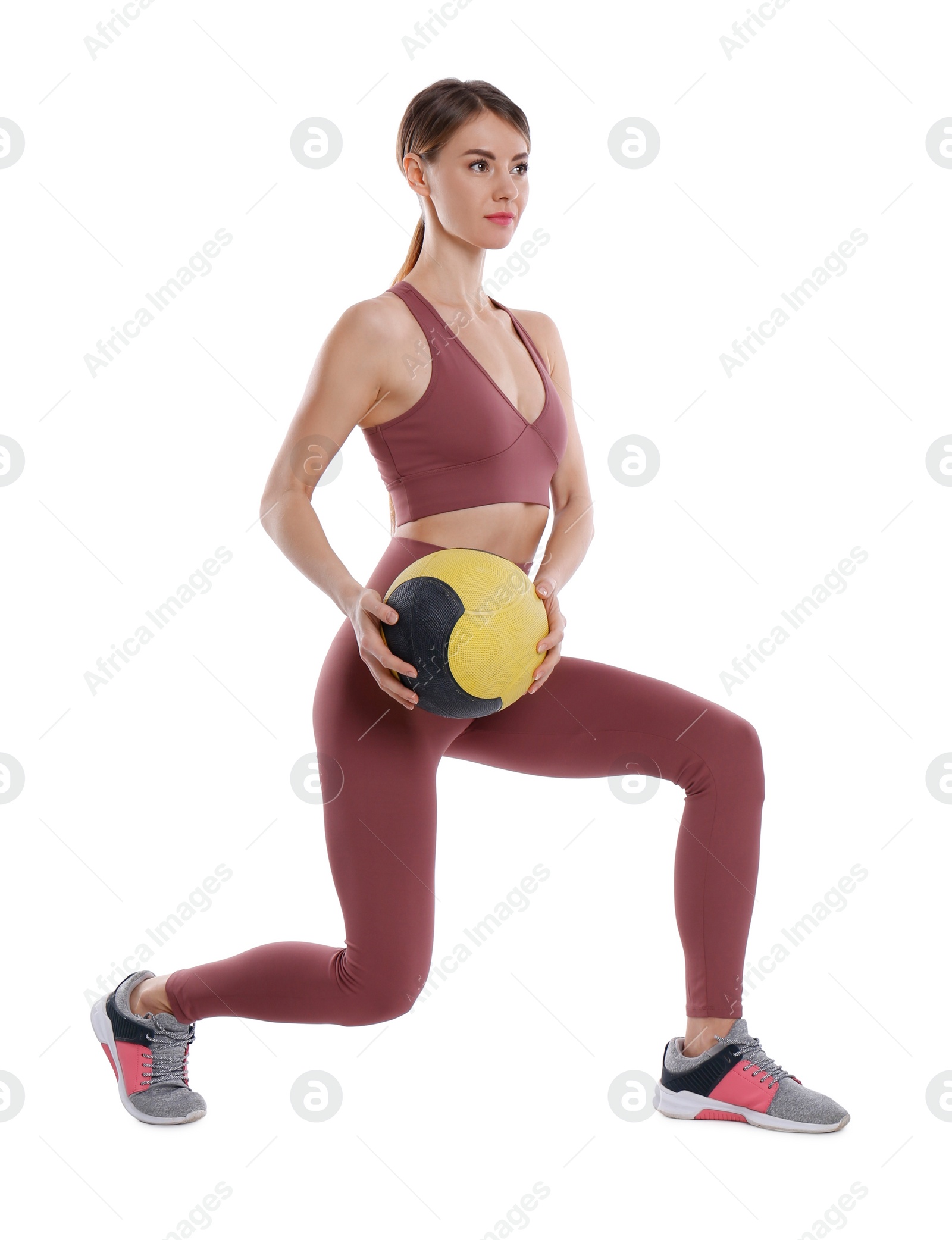 Photo of Athletic woman doing exercise with medicine ball isolated on white