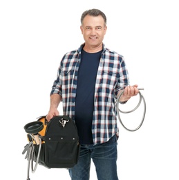 Mature plumber with tool bag on white background