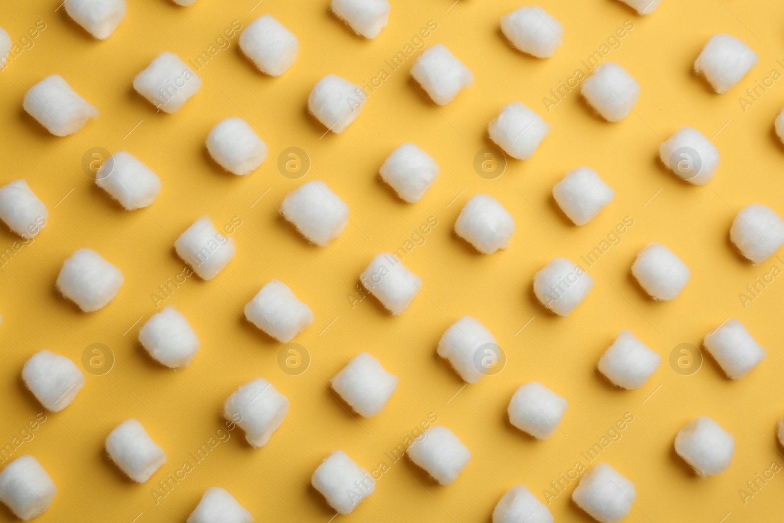 Photo of Many fluffy cotton balls on color background, flat lay