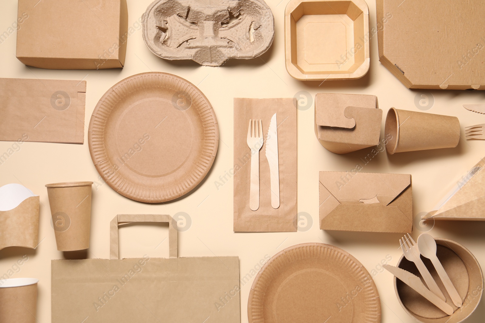 Photo of Flat lay composition with eco friendly food packagings on beige background