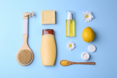 Photo of Flat lay composition with body care products on color background