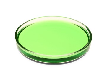 Photo of Petri dish with green liquid sample isolated on white
