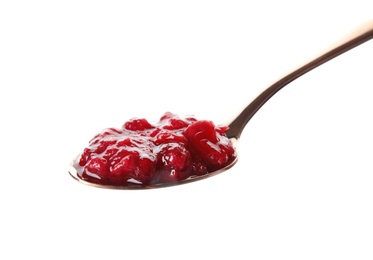 Spoon with cranberry sauce on white background