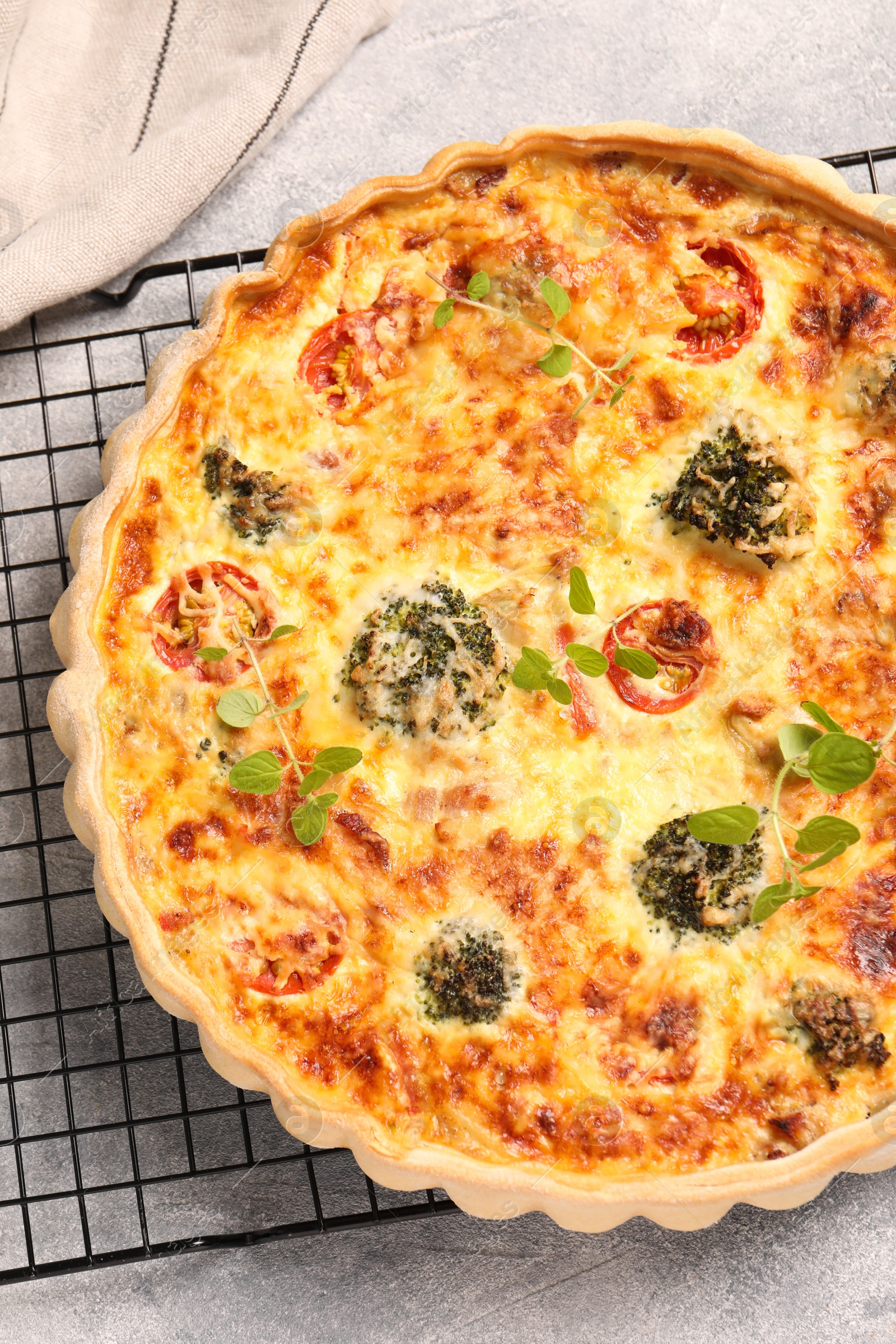 Photo of Delicious homemade quiche on light gray table, top view