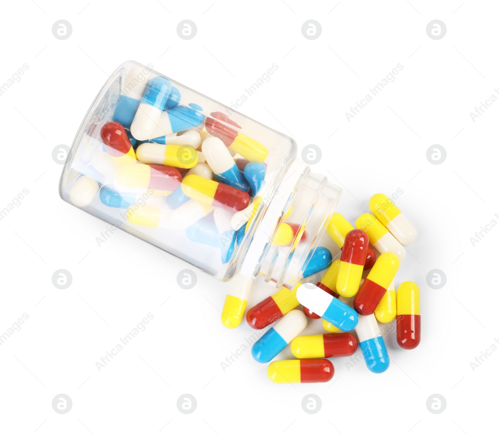 Photo of Antibiotic pills and bottle isolated on white, top view