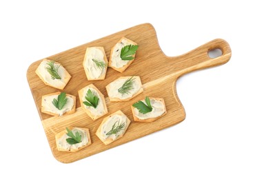 Photo of Delicious crackers with humus, parsley and dill on white background, top view