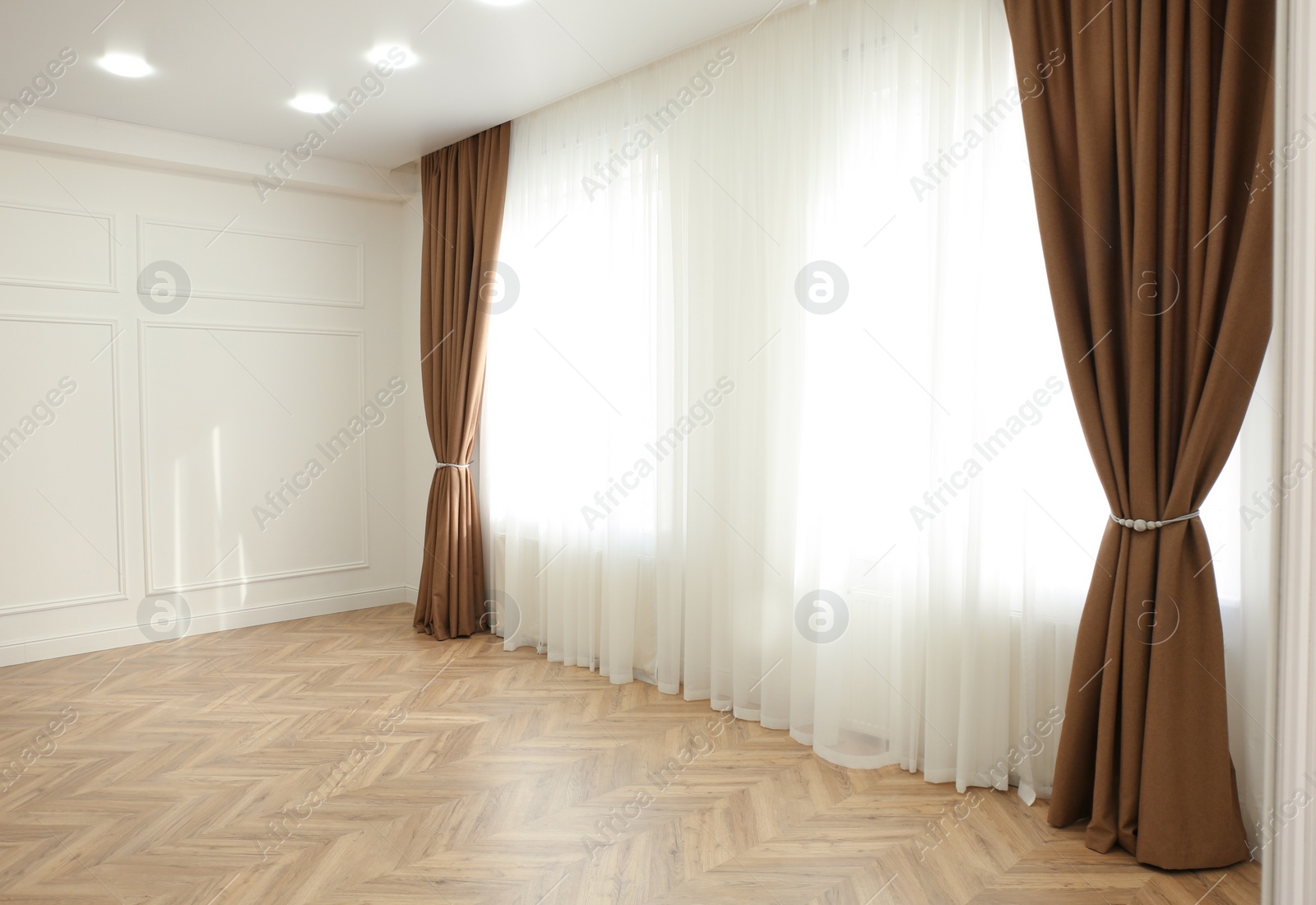 Photo of Windows with elegant curtains in modern room