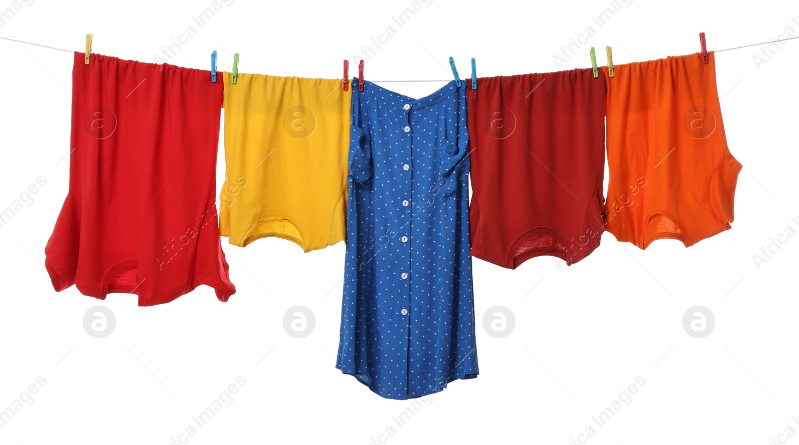 Photo of Different clothes drying on laundry line against white background