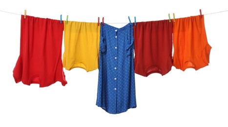 Photo of Different clothes drying on laundry line against white background