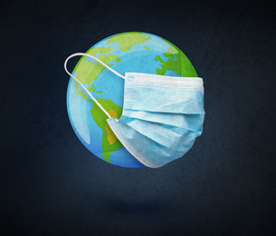 Image of Illustration of Earth with medical mask on black background. Coronavirus outbreak