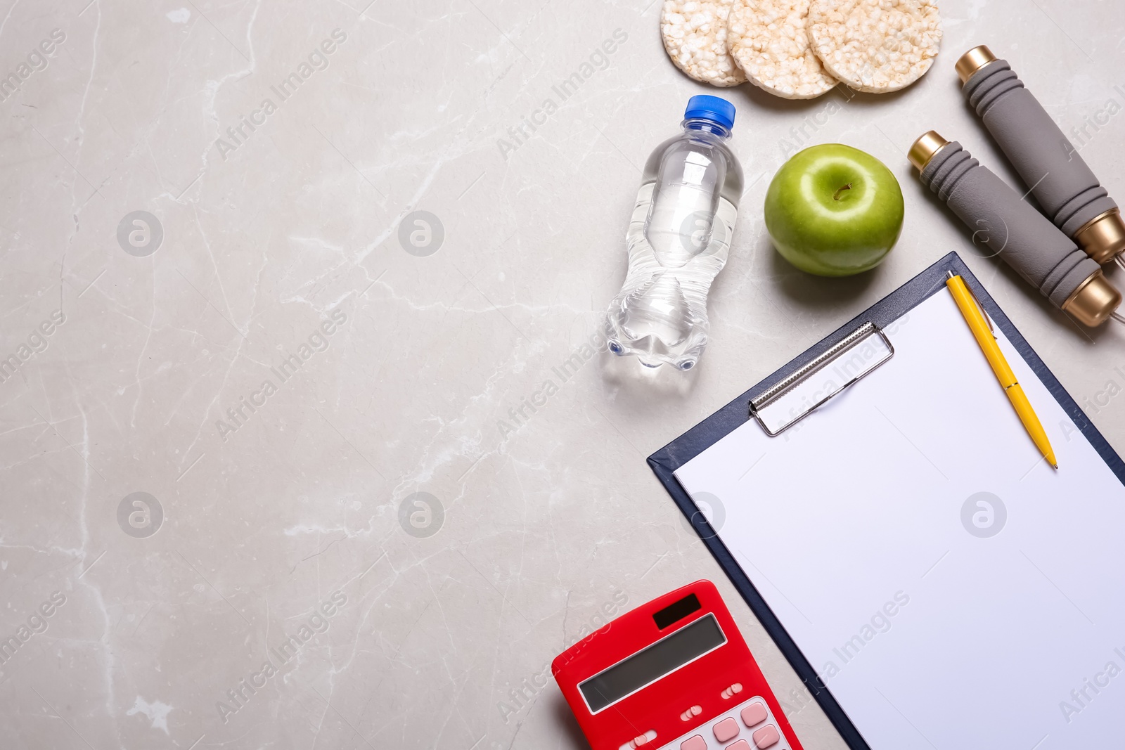 Photo of Flat lay composition healthy food, clipboard, calculator and space for text on grey background. Weight loss concept