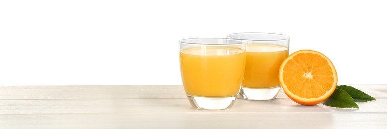 Photo of Delicious orange juice and fresh fruit on wooden table against white background. Space for text