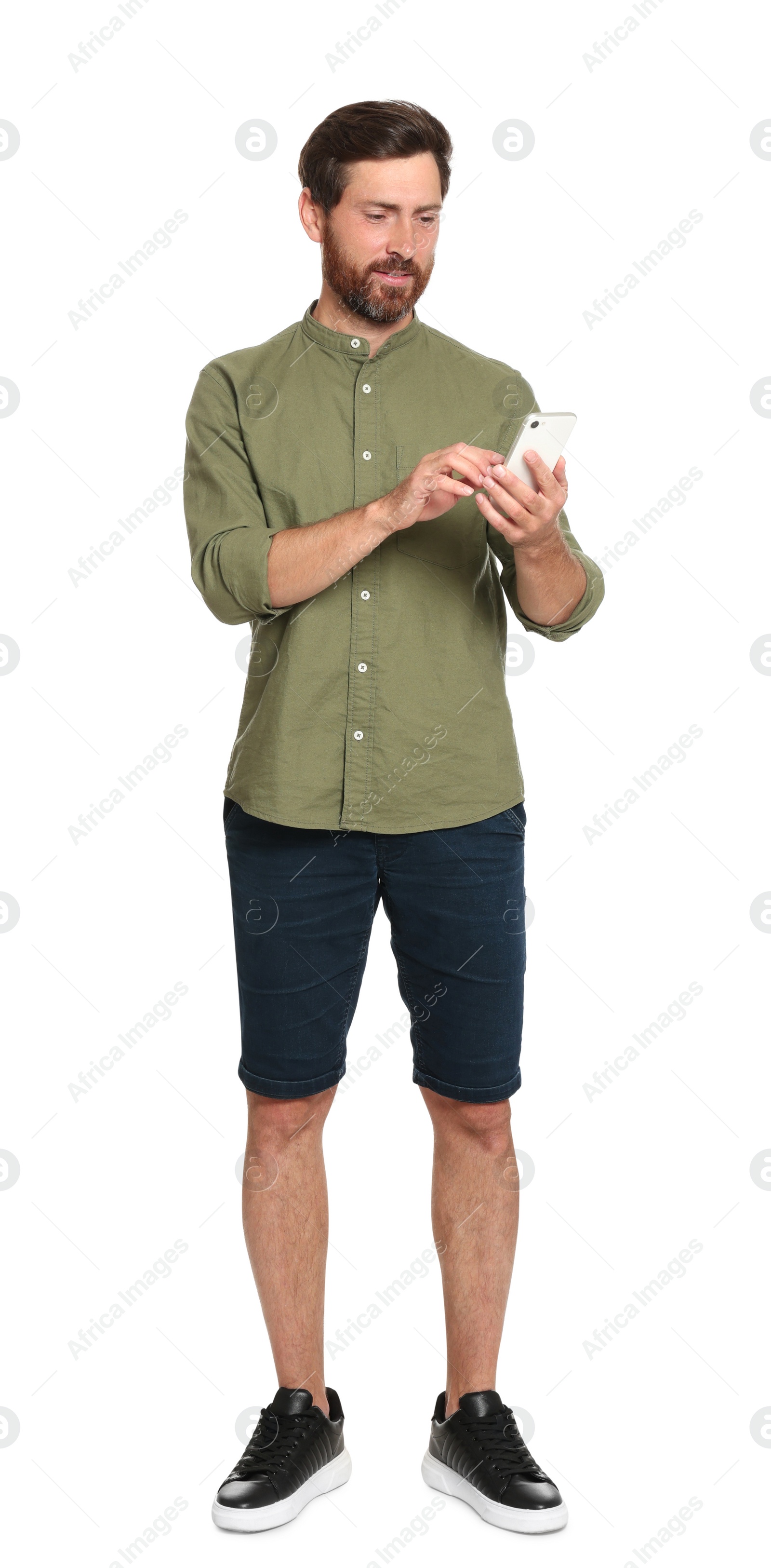Photo of Handsome man with phone on white background