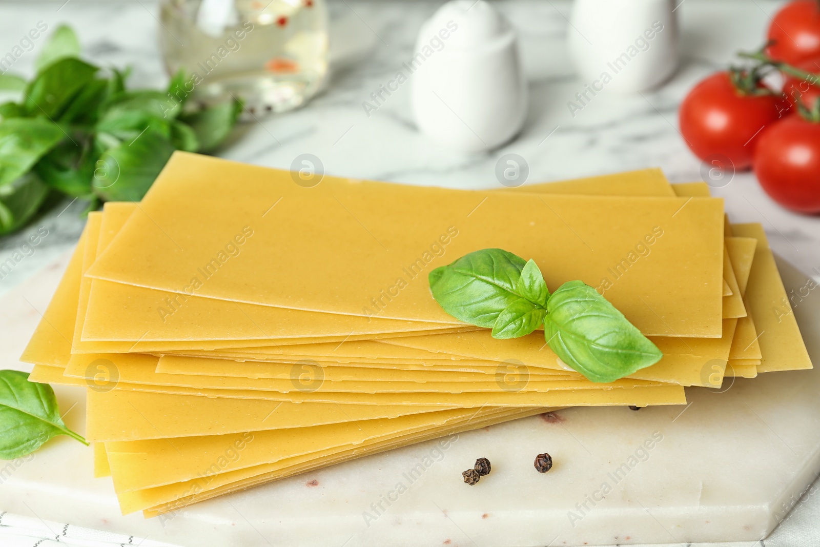 Photo of Composition with uncooked lasagna sheets on table, closeup