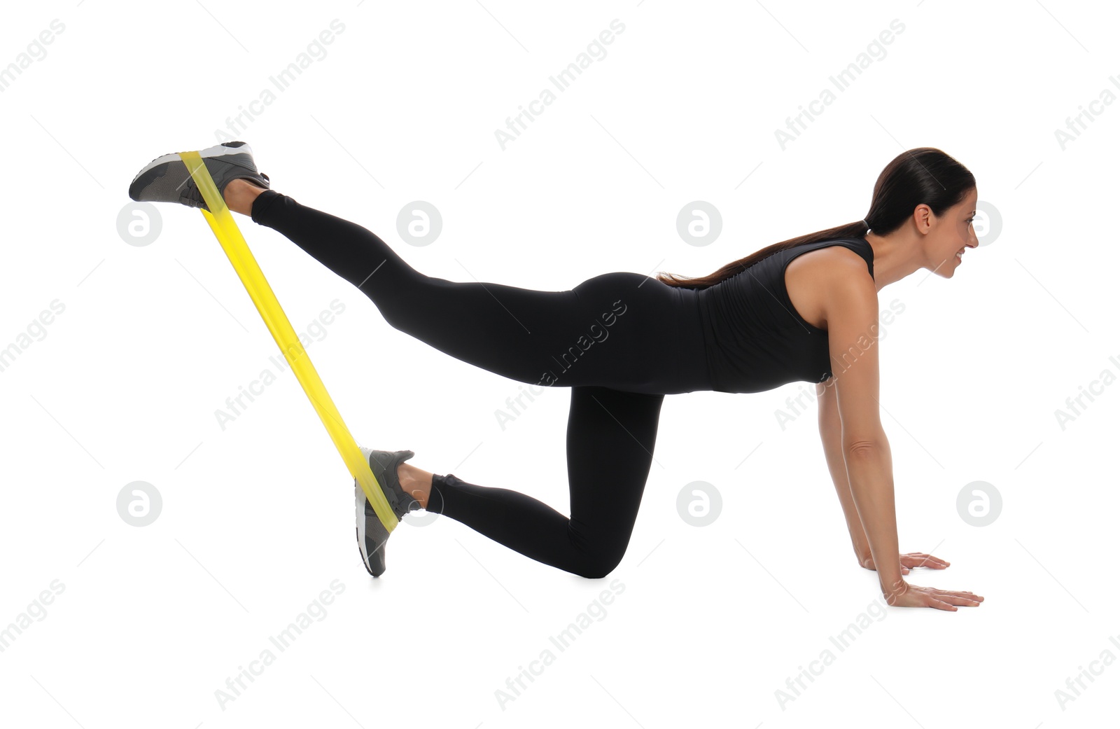 Photo of Woman doing sportive exercise with fitness elastic band on white background