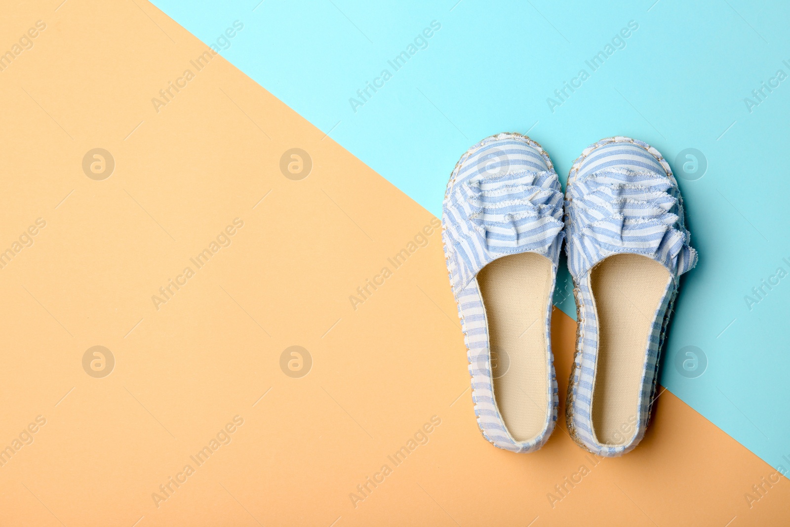 Photo of Stylish new shoes on color background, top view