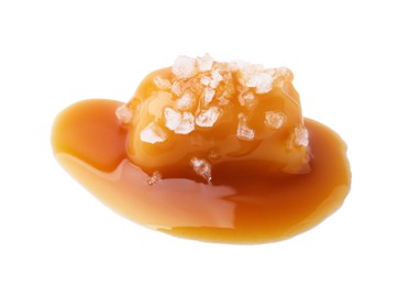 Photo of Yummy caramel candy and sea salt isolated on white