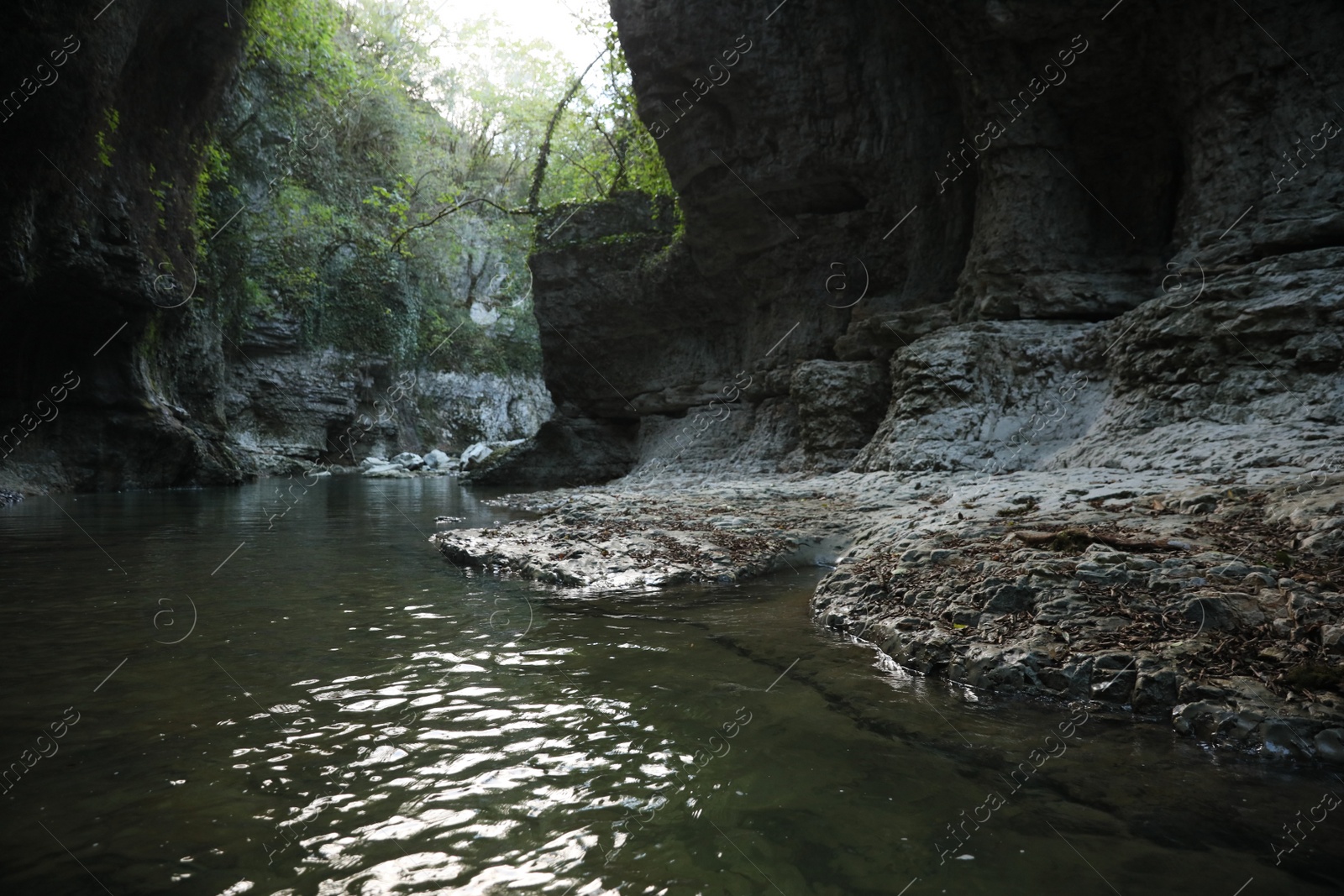 Photo of Picturesque view of clean river near cliffs outdoors