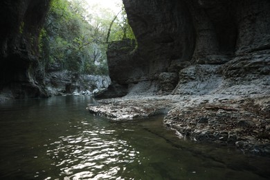 Picturesque view of clean river near cliffs outdoors